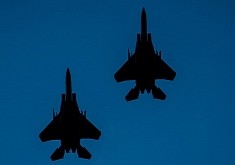 F-15E Strike Eagles Imprint Their Predator Forms on the Blue American Sky