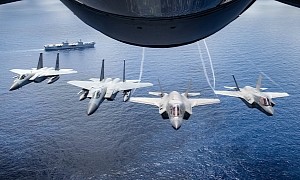 F-35s and F-15s Fly Over HMS Queen Elizabeth, They Look Like a Close Pack of Hungry Wolves