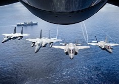 F-35s and F-15s Fly Over HMS Queen Elizabeth, They Look Like a Close Pack of Hungry Wolves