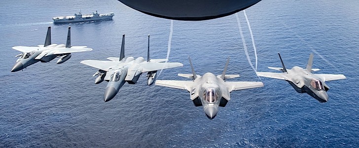 F-35s and F-15s Fly Over HMS Queen Elizabeth