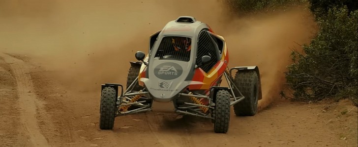 Carlos Sainz driving an all-terrain buggy