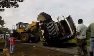 Fail: Bulldozer Rescues Fallen Tipper Truck