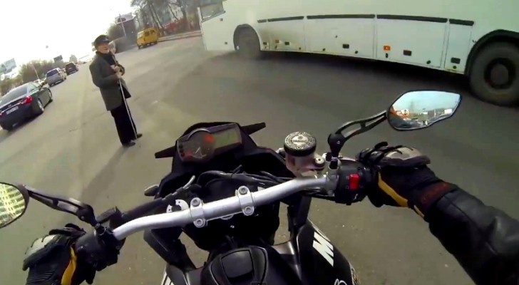 Rider Strops Traffic to Help Blind Old Man Cross the Street