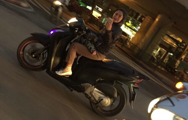 The former football star posted a picture of the Vietnamese woman on his Facebook account showing her driving a scooter in traffic