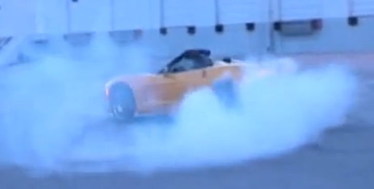 Girl Doing Donuts in a Corvette C6 Convertible