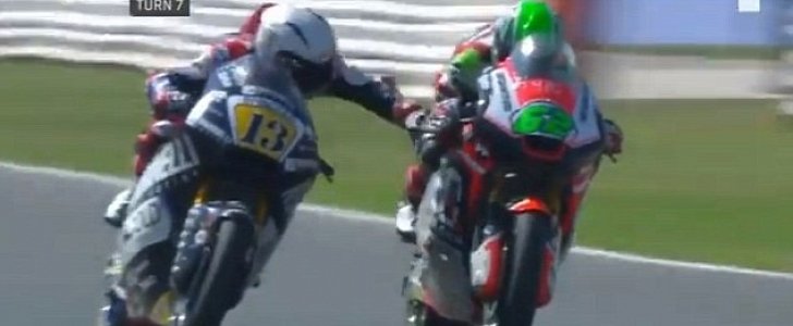 Romano Fenati grabs Stefano Manzi's brake during the 2018 San Marino Grand Prix