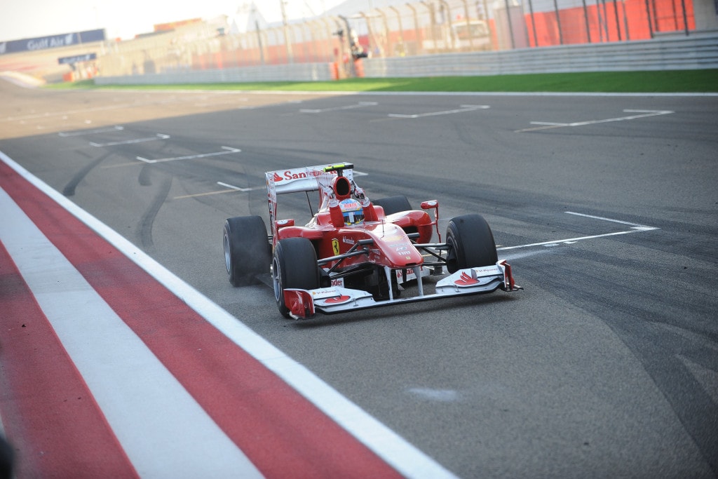 Fernando Alonso crosses the Bahrain GP finish line in 1st place