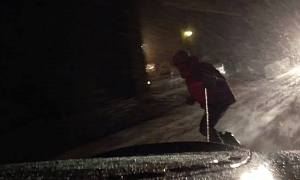Ferrari Pulling a Snowboarder on the Road