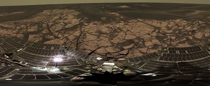 Panorama taken on the rim of Erebus crater. The rover's solar panels are seen on the lower half