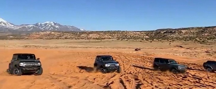 Five 2021 Ford Bronco SUVs demonstrating Trail Turn Assist feature in Moab 