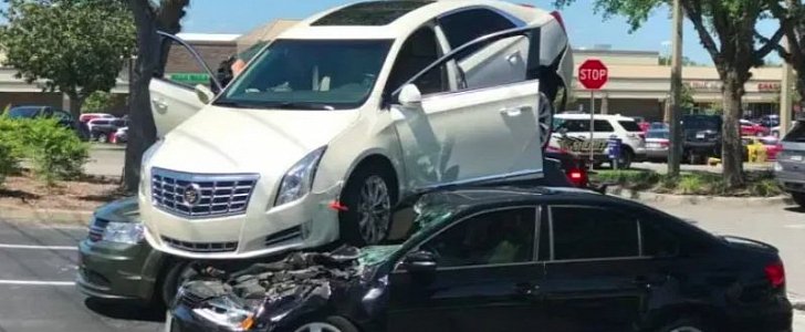 Cadillac XTS parks on top of two other cars in Florida accident