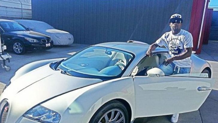 Floyd Mayweather with one of his Bugattis