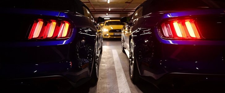 Ford Mustangs in underground parking lot