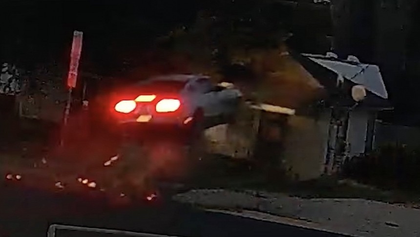 Ford Mustang flies through the air and slams into house