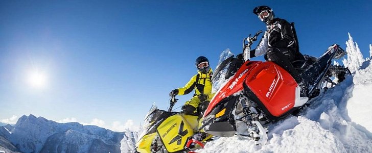 Ski-Doo riders on a snowy summit