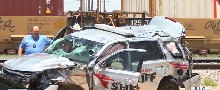 Police Chevy Suburban after impact with speeding freight train