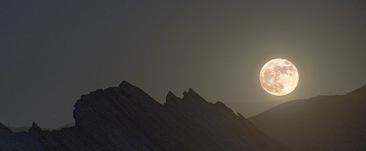 A full Moon rises over Vasquez Rocks Natural Area Park in Santa Clarita, California, on June 24, 2021