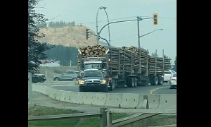 Fully Loaded Logging Truck Being Towed Away by Dodge Ram Is Pickup Power At Best