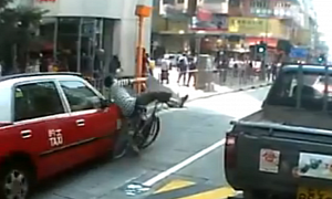 Funny Accident: Taxi Crashes into Bicyclist in HK