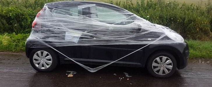 Peugeot 107 wrapped in cling film as punishment for illegal parking