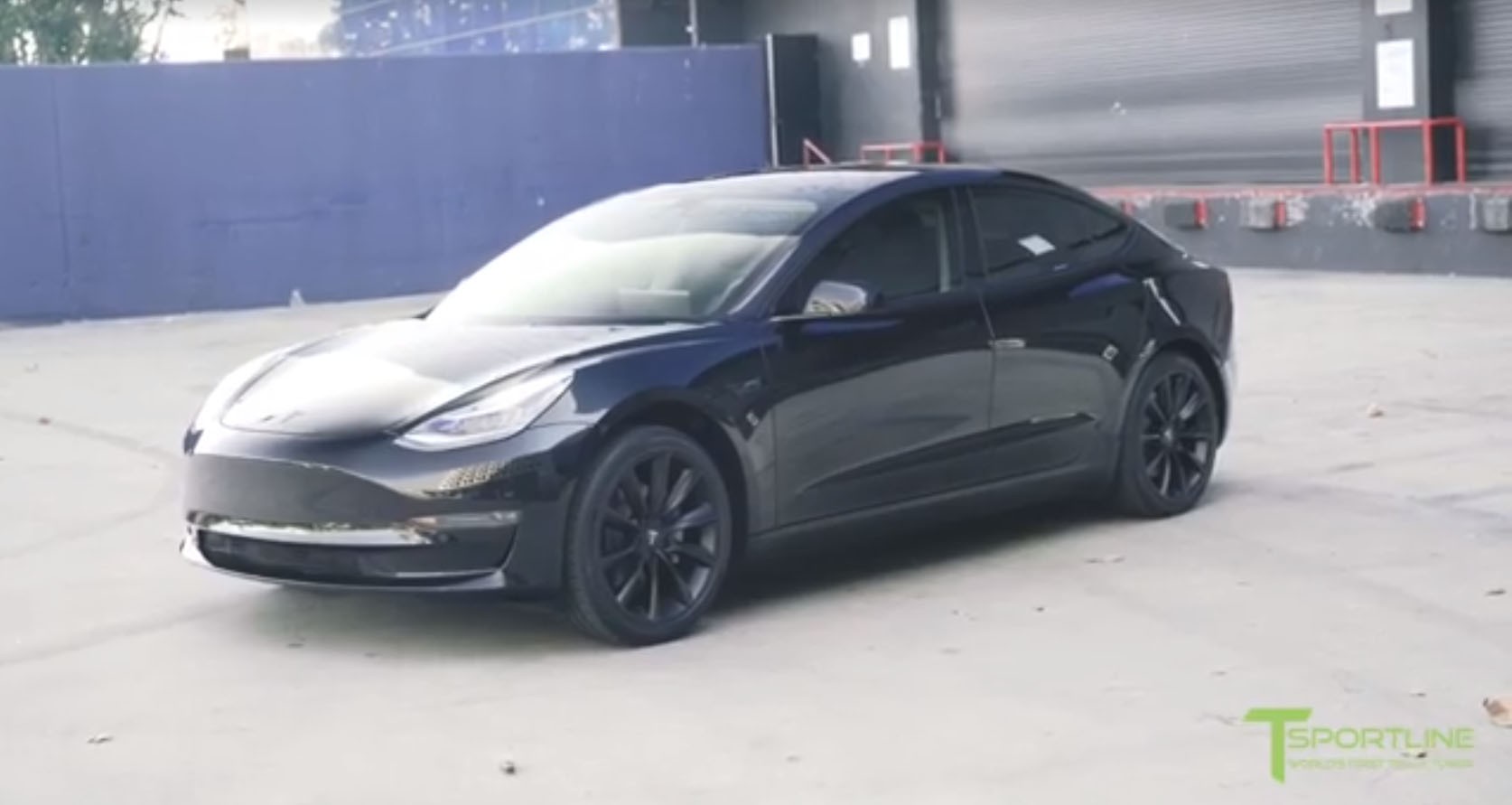 blacked out tesla model 3 looks set to do a drive by shooting
