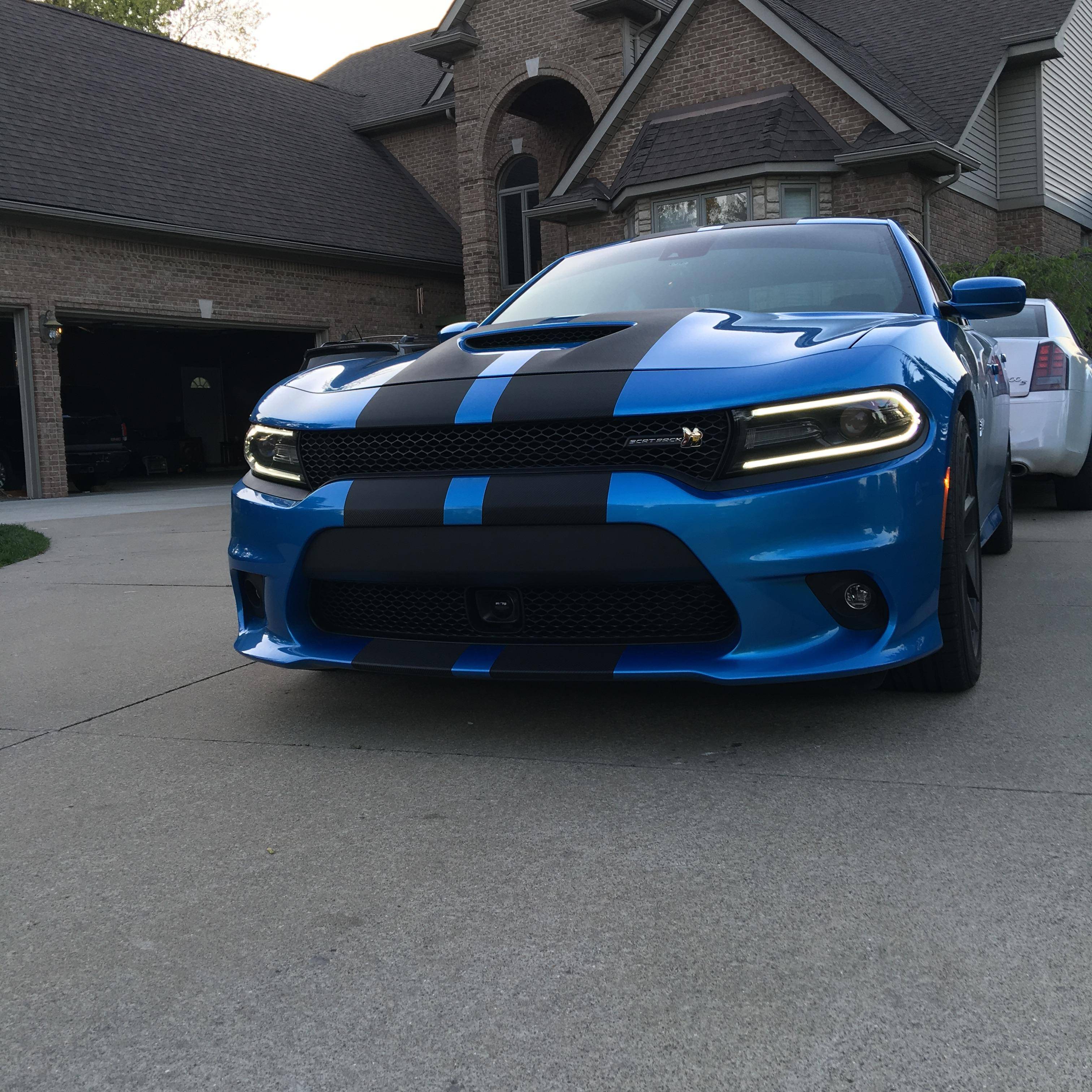 black dodge charger with red stripes