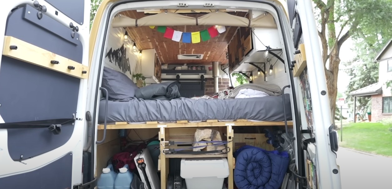 Woman Turns Compact Camper Van Into a Cozy Tiny House on Wheels ...