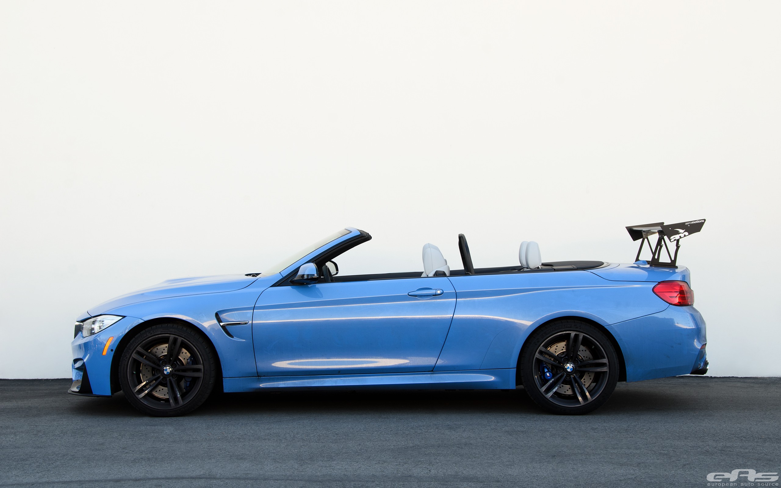 Yas Marina Blue Bmw M4 Convertible Has A Huge Trunk Wing To Boast With Autoevolution