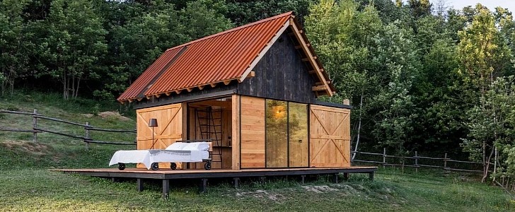 The GlamBOX is a non-wheeled tiny house for glamping, with a master bed that can be rolled outside 