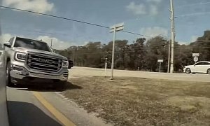 GMC Sierra Driver Goes Off-Road to Overtake Tesla, Sign Says 'No'