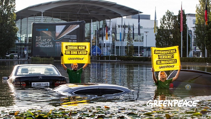 Activists protest against the development of the car industry