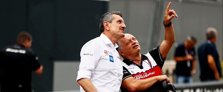 Guenter Steiner (Haas F1 team principal) and Alfa Romeo Team Principal Frédéric Vasseur looking at something