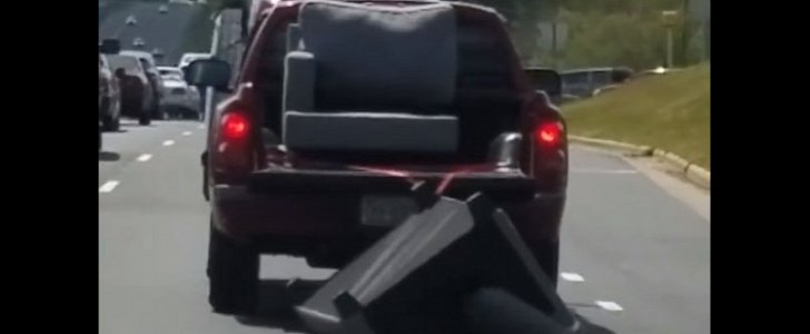 Pickup dragging sofa on the highway