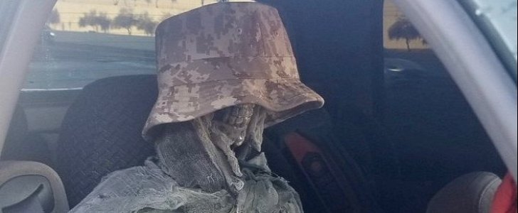 Skeleton disguised as passenger by driver illegally using the HOV lane