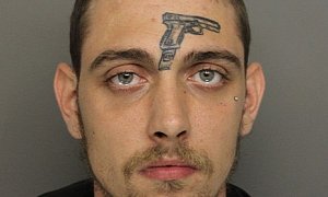Guy with Gun Tattoo on His Forehead Crashes Car, Is Arrested for Gun Possession