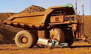 Hapless Australian Drives Loaded Mining Truck Over His Own Pickup