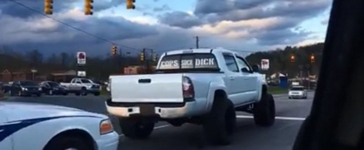 White truck with offensive message