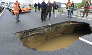 Hell on Earth: Huge Unavoidable Highway Pothole