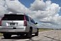 Hennessey Drag Races Its Supercharged 2015 Cadillac Escalade against the Stock Car