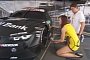 Here’s a DTM Grid Girl Explaining what a Mandatory Pit Stop Is
