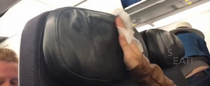 Passenger wipes down headrest on airplane, shows just how dirty it is