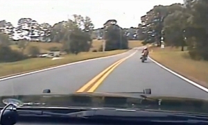 High-Speed Bike Pursuit Results in Police Car Crashing Hard