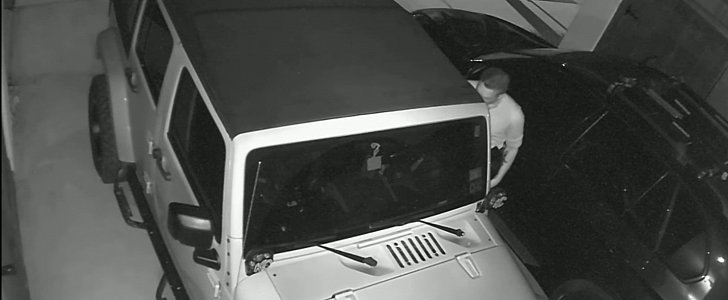 Thief entering Jeep Wrangler