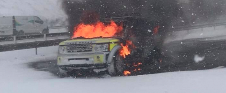 Land Rover on fire in the middle of a snow storm
