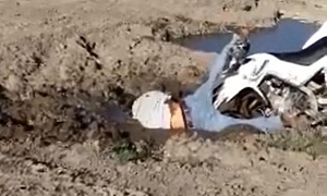 Hilarious ATV Faceplant in Deep Mud