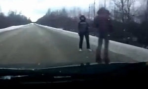 Hitchhikers Cause Crash on Icy Russian Road