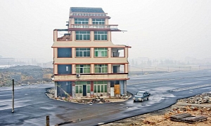 House Stands in the Middle of a Chinese Motorway