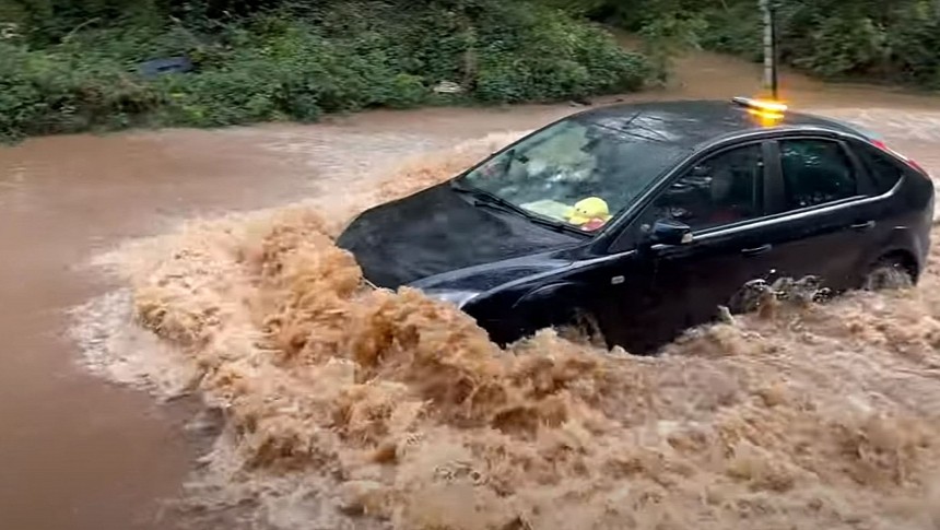 Ford Focus Driver Attempting to Cross a Flooded Road