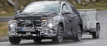Hyundai's 2024 Tucson Spied on Towing Duty, Prototype Kind Enough To Show More of Its Face