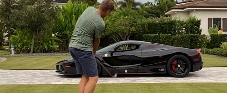 Ian Poulter practices chip shots through the cabin of his Ferrari LaFerrari Aperta, because why not